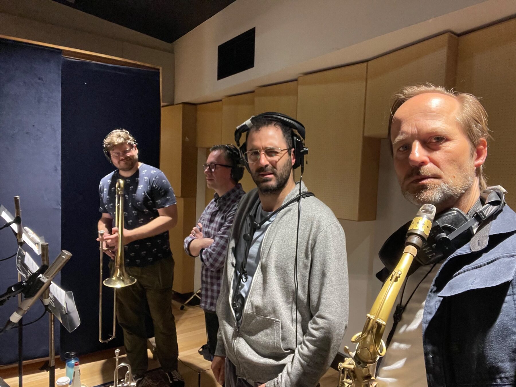 Remco Keijzer with brass players during a studio session